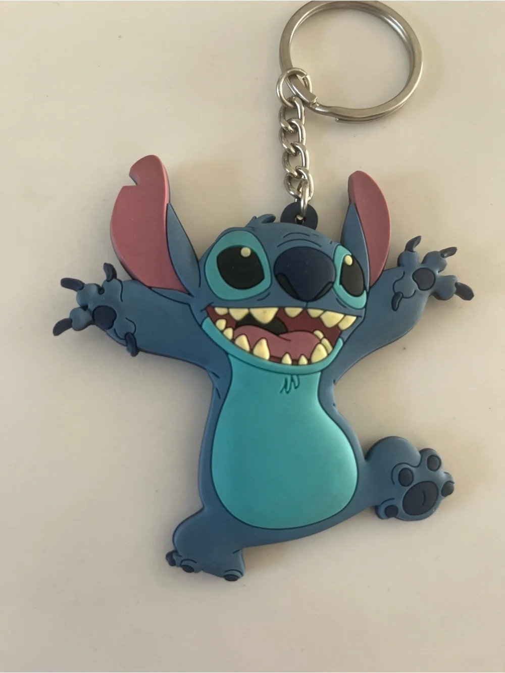 Disney stitch rubber keychain.  Never used, has been sitting in storage.